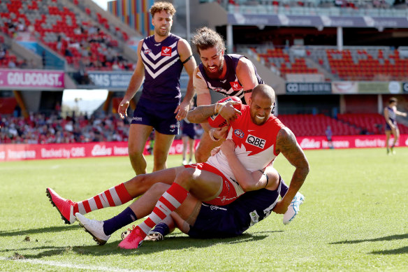 Lance Franklin collects Luke Ryan with his elbow.