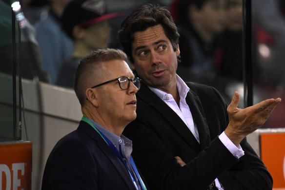AFL boss Gillon McLachlan and operations manager Steve Hocking are part of the AFL executive that will take a 20 per cent pay cut.