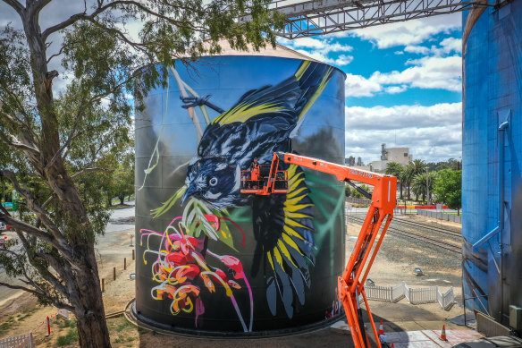 Artist Jimmy Dvate at work in Rochester. 