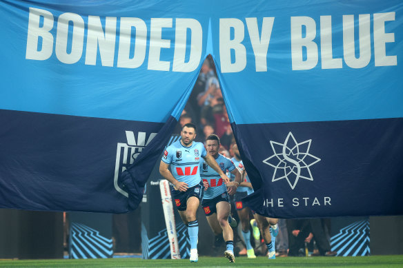 James Tedesco leads the Blues out at Accor Stadium.