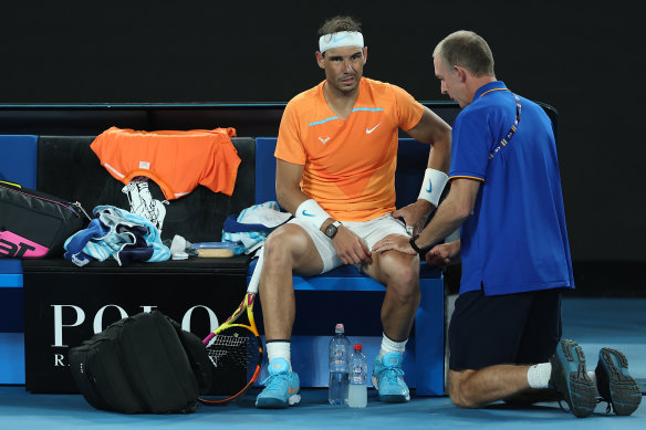 Rafael Nadal receives attention after requesting a medical timeout on January 18 at the Open.