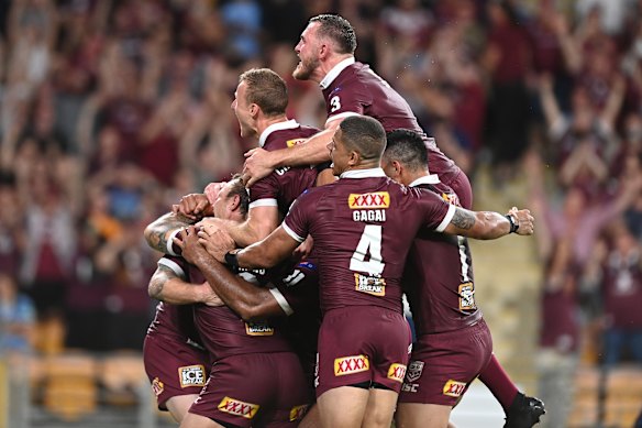 Queensland celebrate a famous Origin series win.