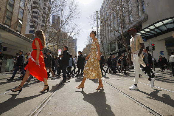A model wearing Forever New (centre) walks in a pop-up runway at Melbourne Fashion Week.