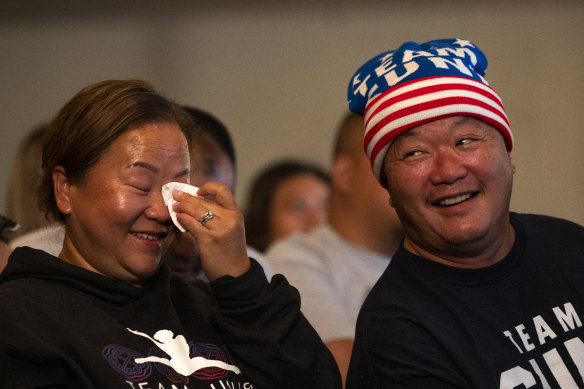 Sunisa Lee’s father John (right) and mother Yeev react to her gold medal.