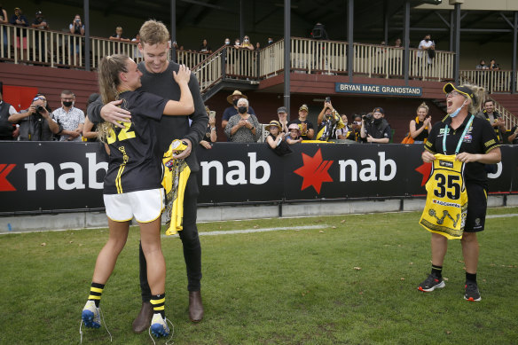 Tom Lynch presents sister Beth with her jumper before the game.