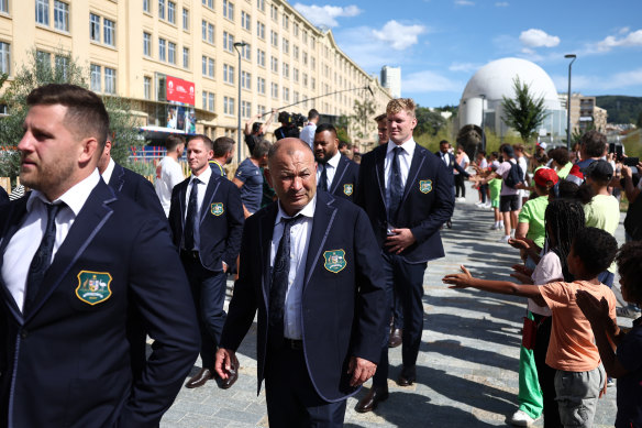Wallabies coach Eddie Jones and Australian players arrive for an official function. 