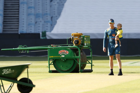 Tim Paine and son Charlie inspect the MCG pitch before the Boxing Day Test last year.
