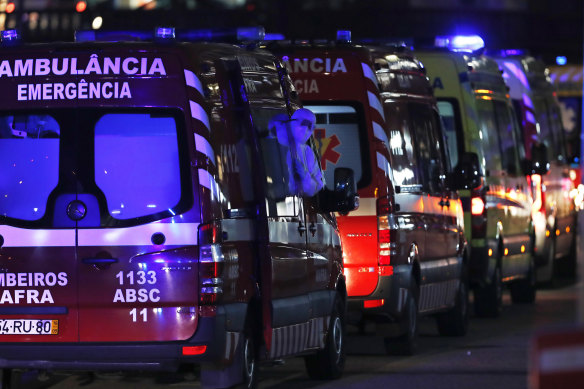 More than 30 ambulances wait to hand over COVID-19 patients to medics at the Santa Maria hospital in Lisbon in January.