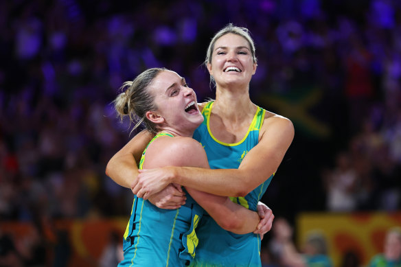 Australian netballers Gretel Bueta and Liz Watson celebrate gold in the final at Birmingham.