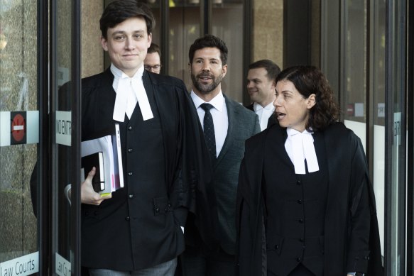 Heston Russell, centre, flanked by his barristers Nicholas Olson (left) and Sue Chrysanthou, SC, (right) on Tuesday.