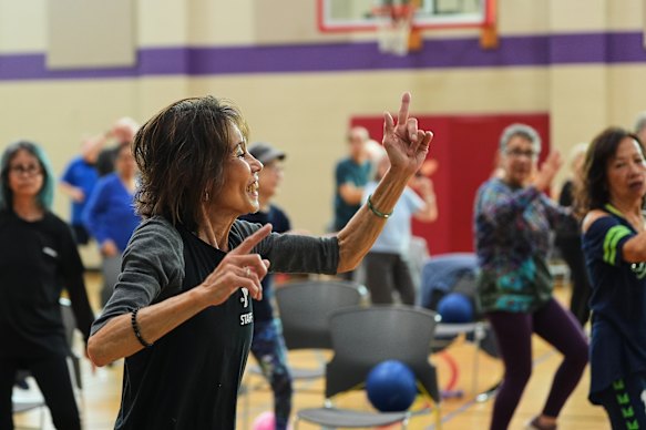 Instructor Bengie Santos, 72, leading a group class in Shoreline, Washington.