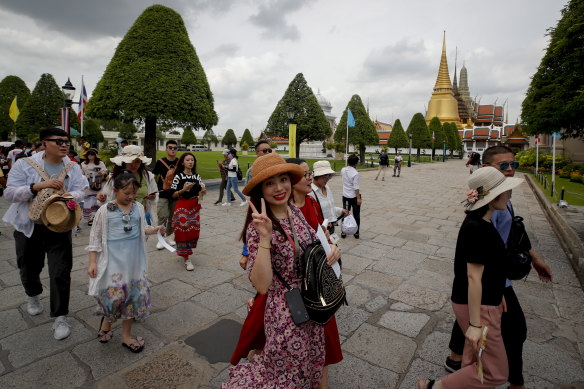 Chinese tourists visit the Grand Palace in Bangkok, Thailand, pre pandemic.