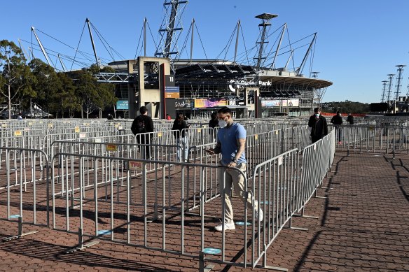 People attending the Qudos Bank Arena mass vaccination hub at Sydney Olympic Park on Monday morning.