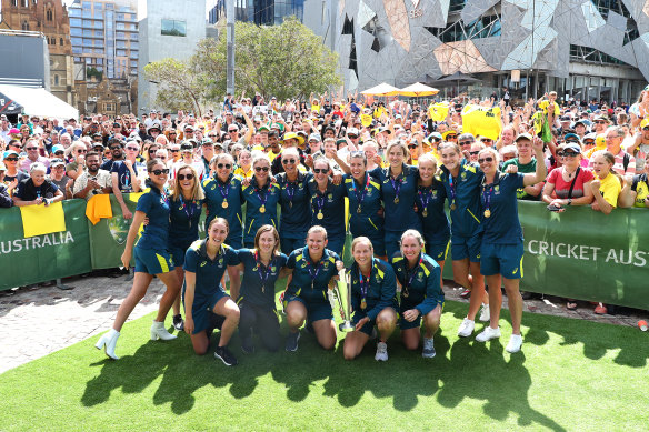 The Australian team celebrates with fans at Fed Square.