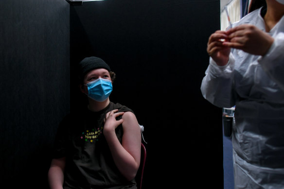 A student visits a temporary pop-up COVID-19 vaccination hub at Glenroy College.