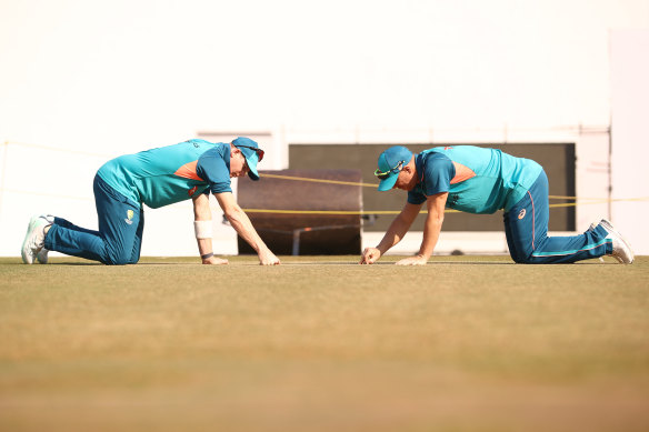 Steve Smith and David Warner of Australia check the pitch during a training session before the Nagpur Test.