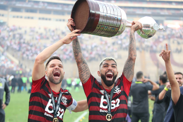 Gabriel Barbosa lifts the trophy after his two late goals secured the win for Flamengo.