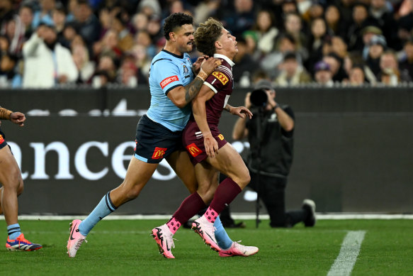 Latrell Mitchell pushed over Reece Walsh during game two of Origin at the MCG.