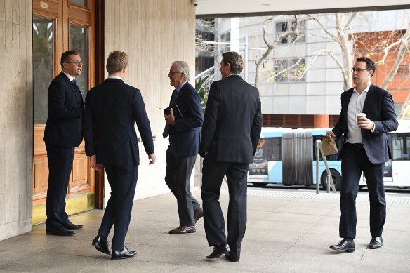 Men arrive at the men’s only Australian Club for the vote on whether to allow women as permanent members.