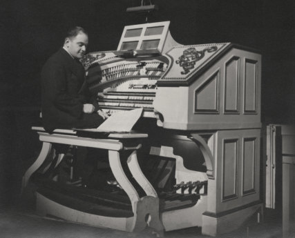 Organist Stanfield Holliday playing Eliza - then painted white - at the Capitol, c1946.