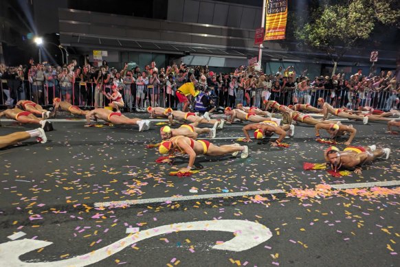 Surf Lifesavers show off their push-ups at the Sydney Mardi Gras.