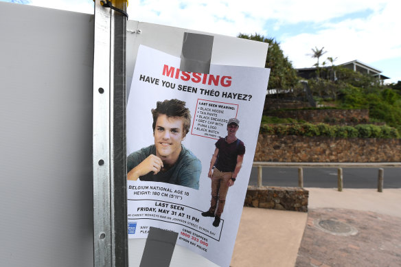 A missing persons flyer near a beach.