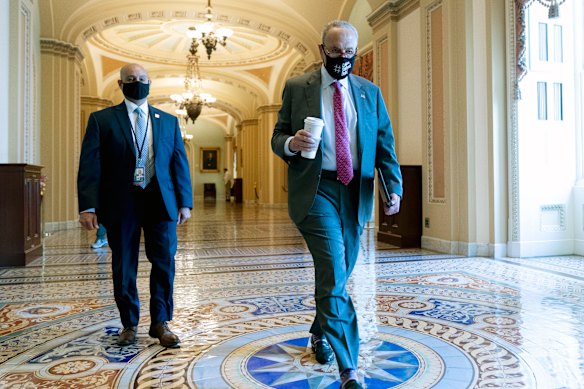 Senate Majority Leader Chuck Schumer arrives ahead of the Senate vote on the $1 trillion infrastructure package.