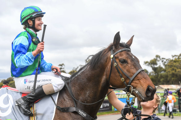 Michelle Payne returns to the mounting yard on Jukila after winning the No Fuss Event Hire BM64 Handicap at Bendigo Racecourse on October 26, 2022. 