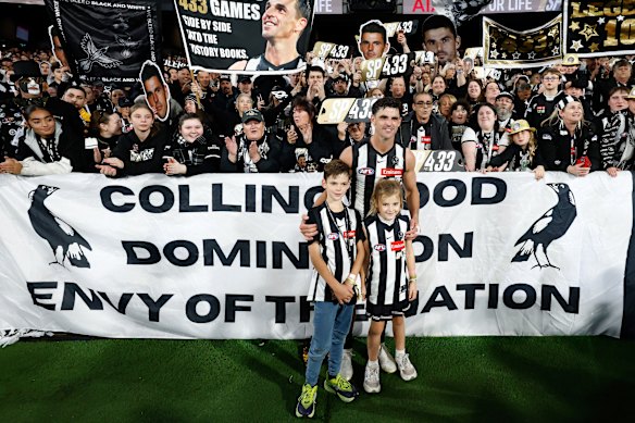 Pendlebury with son Jax and daughter Darcy in front of “the Magpie Army”.