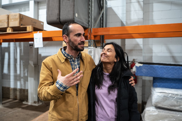 Re-Love employee Mostafa Azimitabar, a Kurdish refugee, left, next to founder Renuka Fernando in the organisation’s Sydney warehouse.