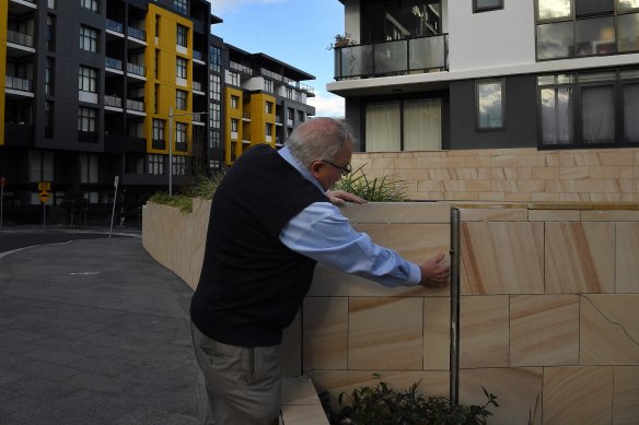 The Building Commissioner inspects a wall with a large gap at Meadowbank in Sydney's north.
