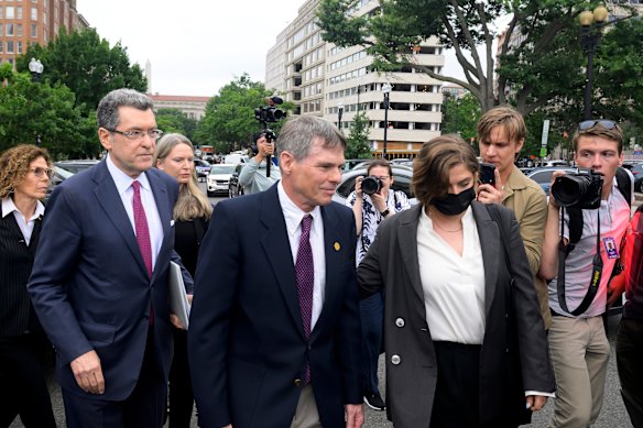 Former Olympic canoeist David Hearn (centre) and his attorney Norman Eisen (left) after Hearn pleaded not guilty to the charges.