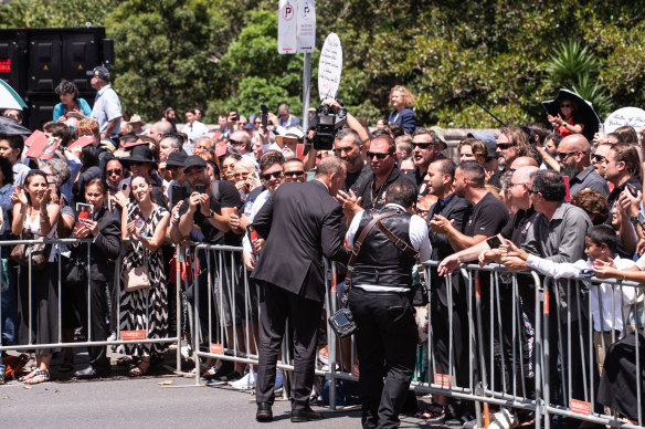 Tony Abbott greets supporters of George Pell after the funeral service at St Mary’s Cathedral.