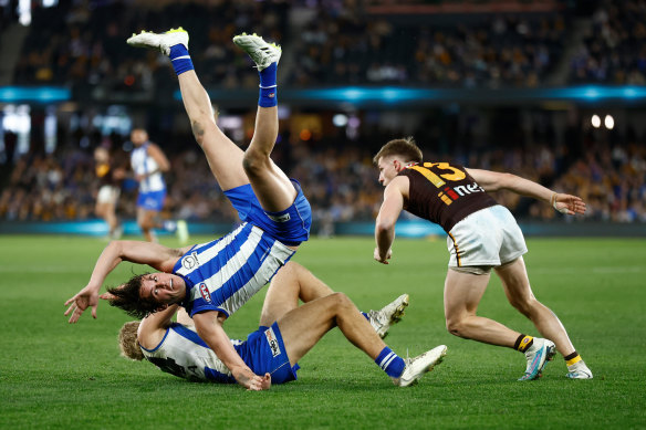 North Melbourne crashed to their 15th straight defeat on Sunday, with Curtis Taylor (top) and Jackson Archer (below) among those feeling the pain as Dylan Moore and his Hawthorn teammates registered a compelling win.