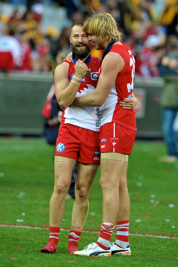 Lewis Roberts-Thomson embraces Nick Malceski after achieving the ultimate success.