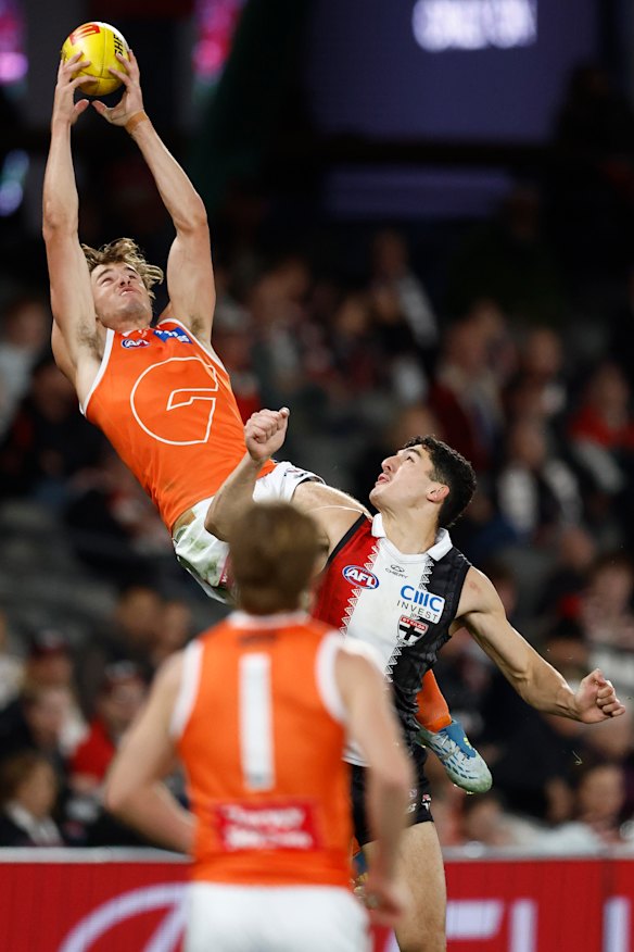 Aaron Cadman stretches to take a mark for the Giants.