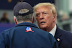 President Donald Trump talks with Sen. Dan Sullivan at a campaign event earlier this month.