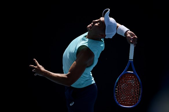 James McCabe serves in his first-round match.