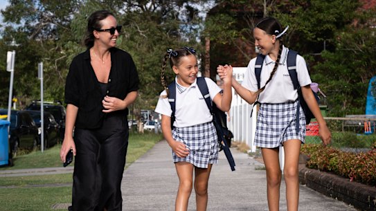 Bernardo Mason walks with her daughters Pearl, 8, and Ivory, 10, to Galilee Catholic Primary School in Bondi Beach.