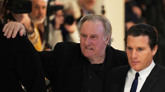 Actor Gerard Depardieu leaves to the courtroom for a break.