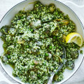 Clams with fregola, peas and parsley pesto