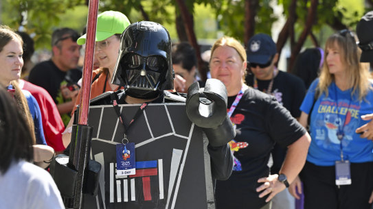 Andrea Feale is dressed as Lego Darth Vader outside the D23 convention.
