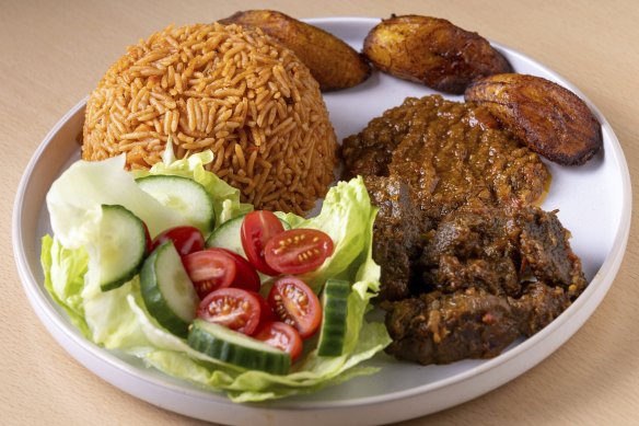Jollof rice with beef and fried plantain.