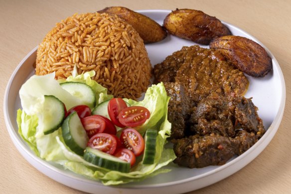 Jollof rice with beef and fried plantain.