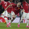 Manchester United players celebrate after winning their FA Cup semi-final on penalties.
