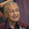 FILE - In this Feb. 22, 2020, file photo, Malaysian Prime Minister Mahathir Mohamad, speaks during a press conference in Putrajaya, Malaysia.  Malaysia's alliance government under 94-year-old Prime Minister Mahathir is threatening to unravel less than two years after a historic election victory ousting the coalition that had ruled the country since independence.(AP Photo/Vincent Thian)