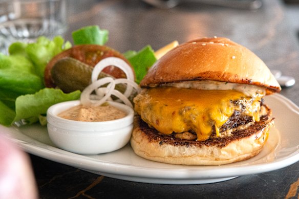 A cheeseburger is on the late-night supper menu at Gimlet.