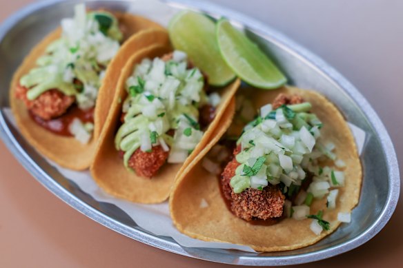 Mamasita's fish tacos are built on made-to-order masa tortillas and finished with plenty of lime.