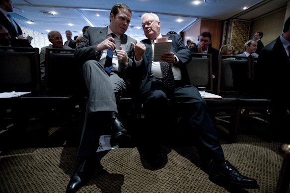 Paul Howes and Graham Richardson confer during the book launch of “Confessions of a Faceless Man” by Howes, in 2010.