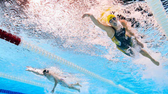 Australia’s Alexa Leary, right, powers past Netherlands swimmer Thijs van Hofweegen.